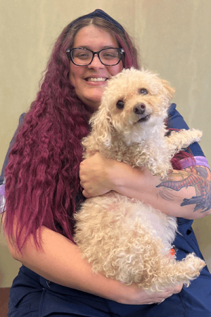 Britney holding tan dog